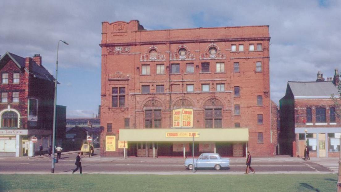 Historic image of Crown Bingo Club with car and people walking in front -possibly from 1970s or 1980s