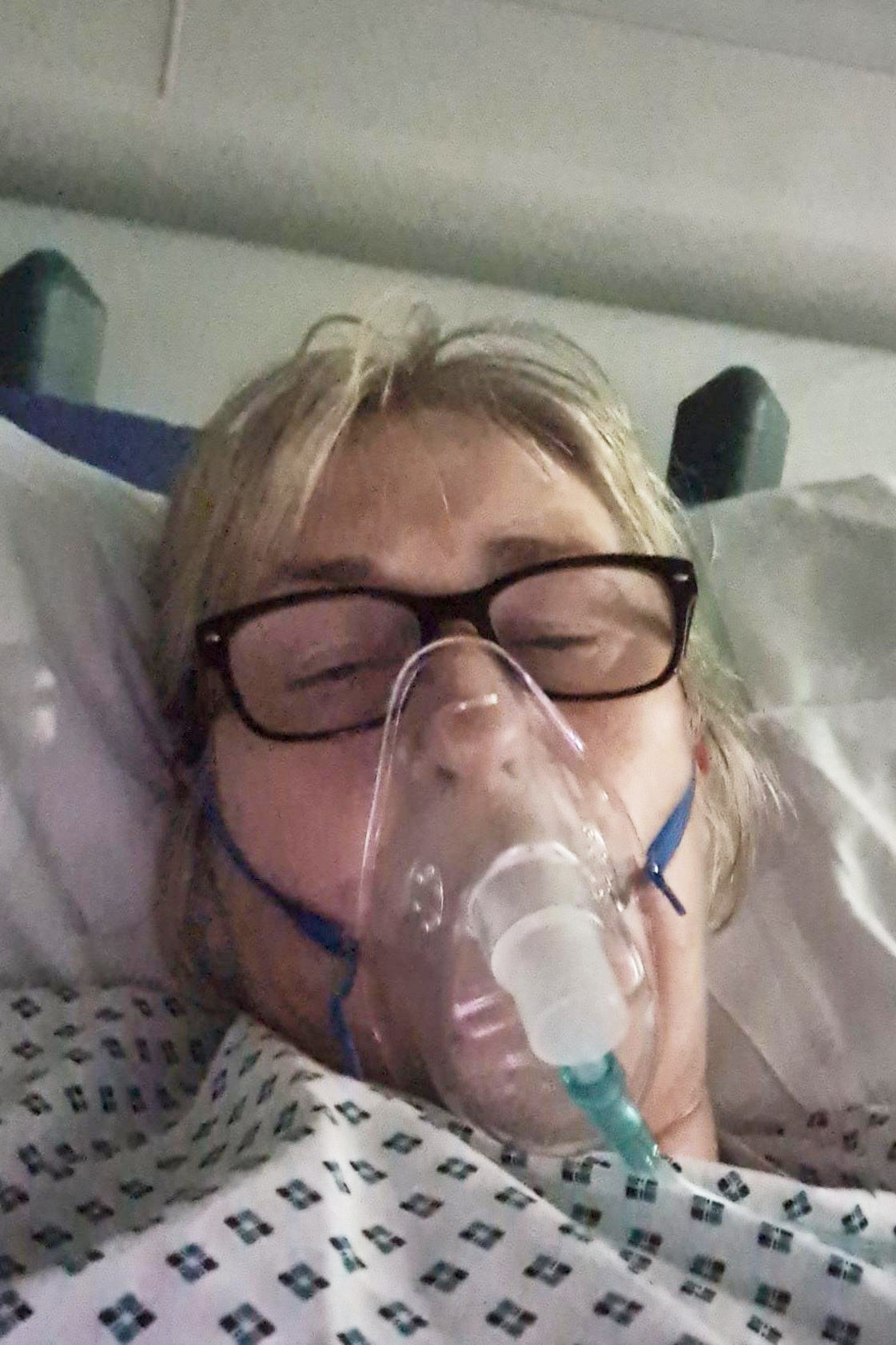 Amanda wearing an oxygen mask in hospital