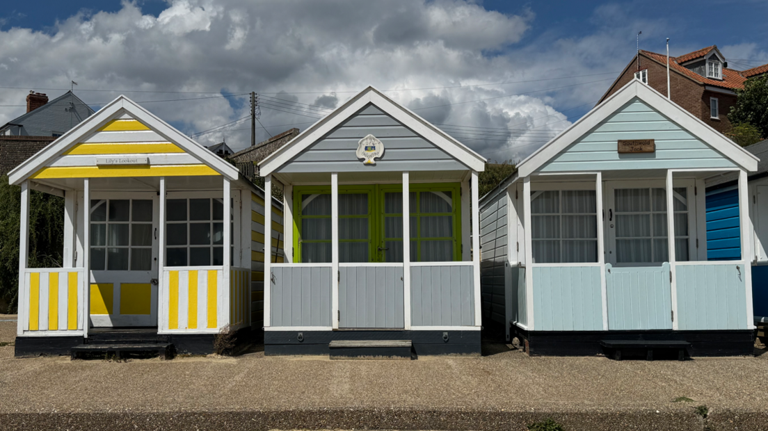Three beach huts in a row
