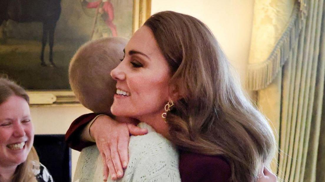 A close-up of a smiling Princess of Wales hugging Liz Hatton.