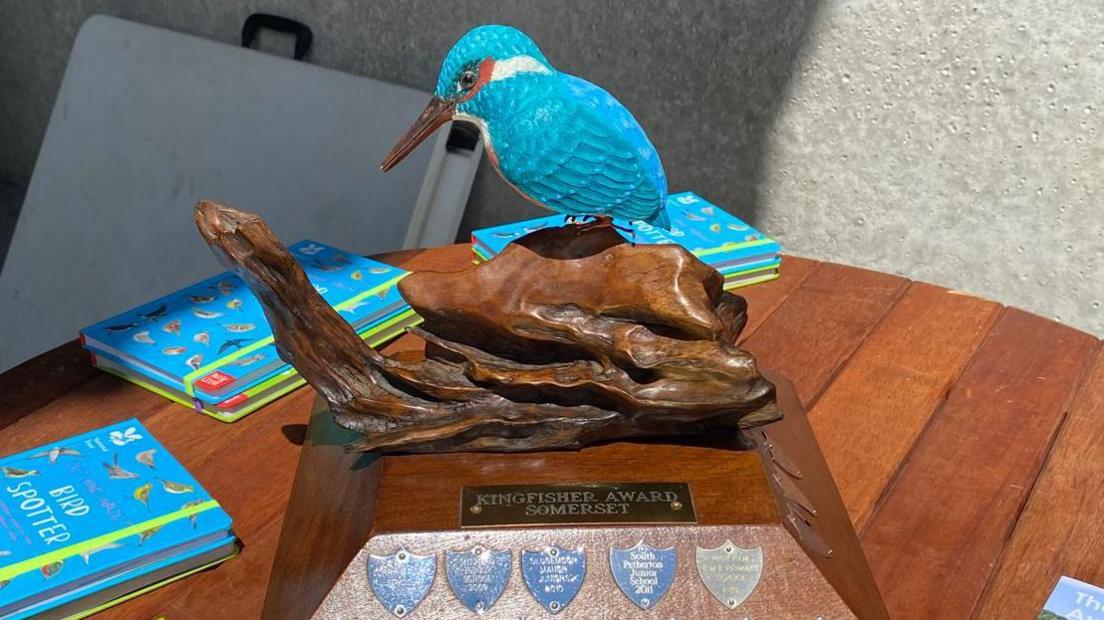 An award with a Kingfisher on it