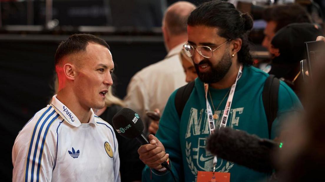 Josh Warrington talks to a reporter at the Grand Arrivals in London