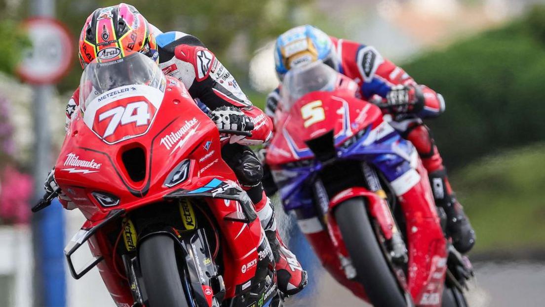 Davey Todd leads Dean Harrison during a Superstock race at the 2024 North West 200
