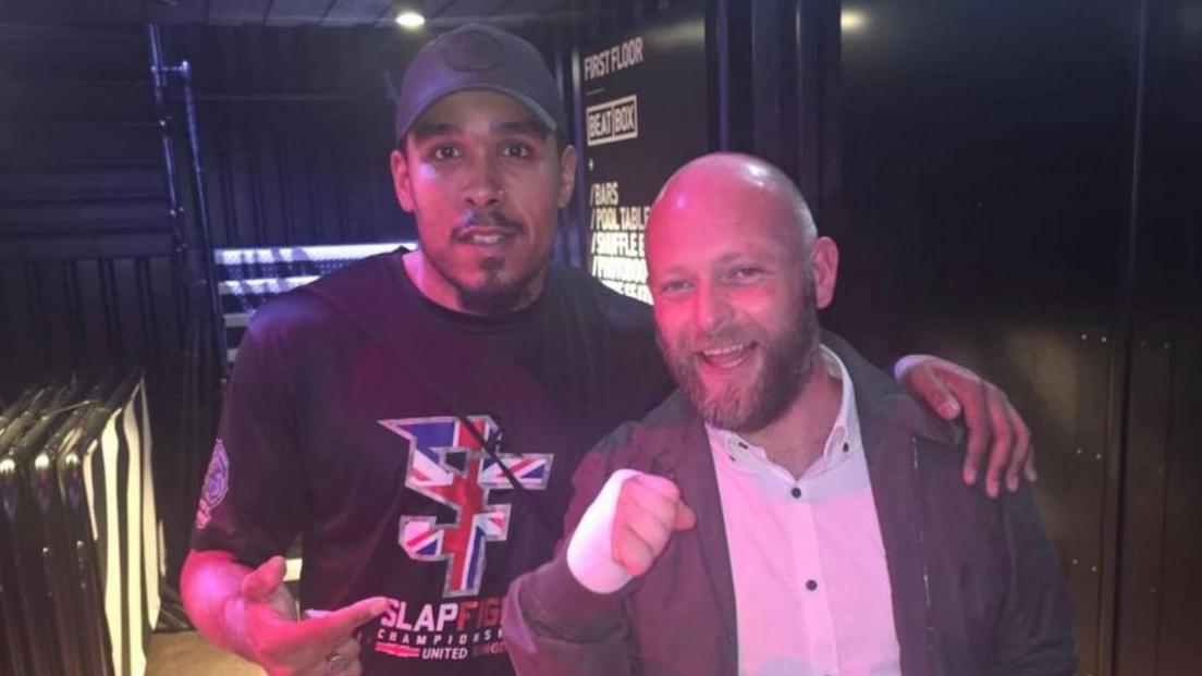 Photo shows Josh Skeete and an unidentified man outside the arena at the BOx Park in Liverpool. 