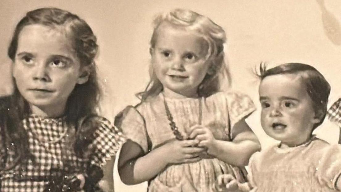 Jenny, Wendy and Christina Read as children. It's a black and white photo.