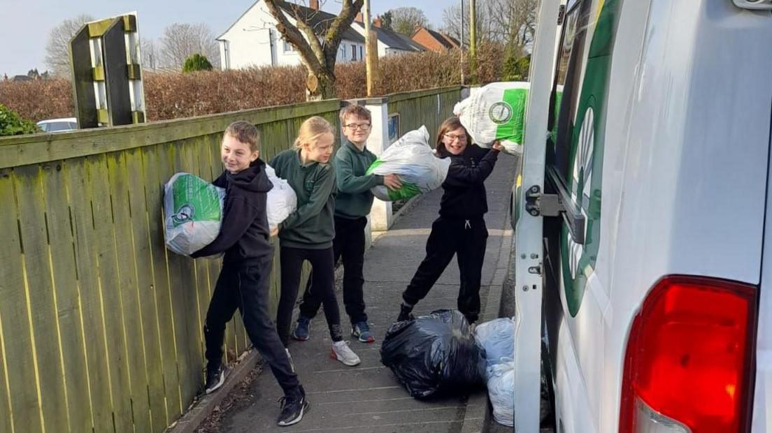 Children loading bags 