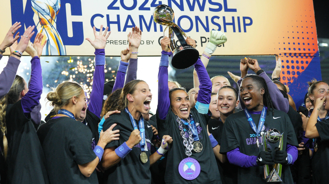 Marta lifts the NWSL trophy after the Orlando Pride win the championship game