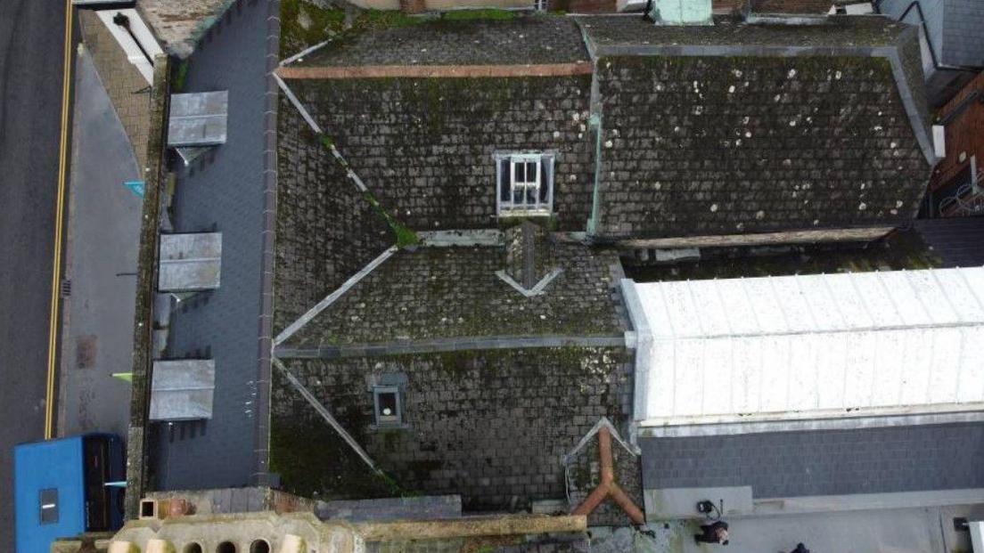 Aerial view of the grey pitched roofs of Dorset Museum