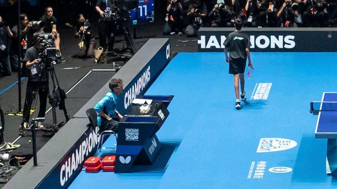 Ben Foote umpires the final of the World Team Championships in London between China and Japan earlier this month