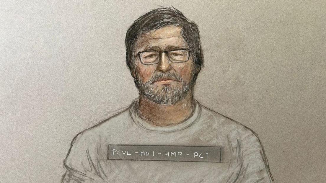 Court artist picture of Vladimir Motin he has short dark hair and beard and is wearing glasses and a grey top