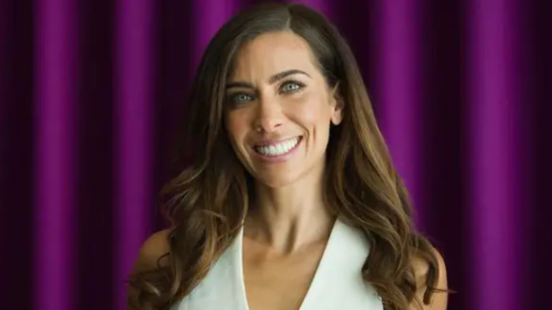 Lilly Sabri smiles and looks towards the camera