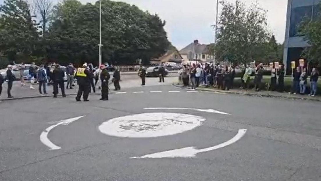 Opposing protesters outside the Holiday Inn in Chatham