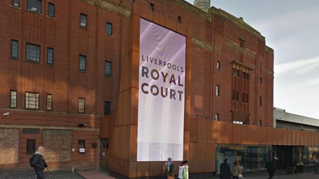 Red brick theatre building with a digital screen which says Liverpool's Royal Court