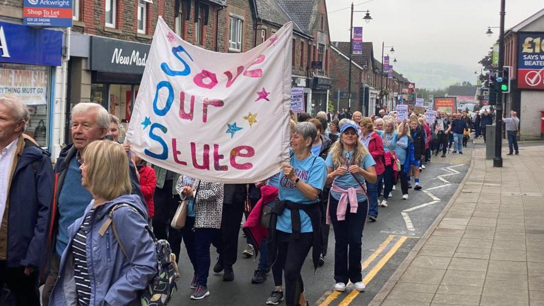 Campaigners marching through Blackwood protesting the proposed closure of the the miners' institute