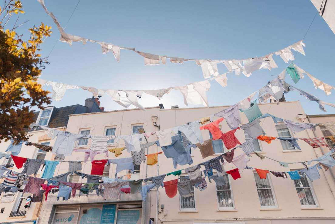 Many shirts hang from buildings in St Helier as part of Kaarina Kaikkonen's artwork.