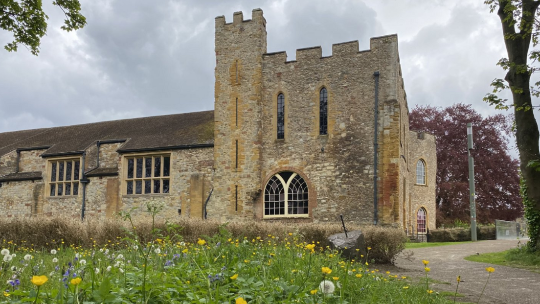 The Museum of Somerset with flowers in the foreground