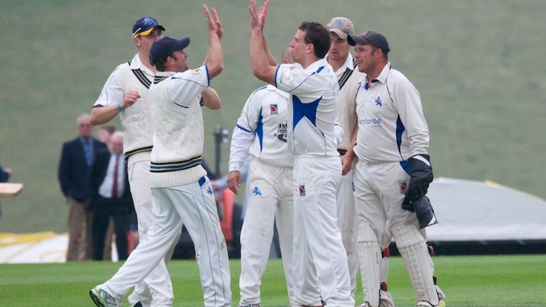 Devon celebrate taking an Oxfordshire wicket