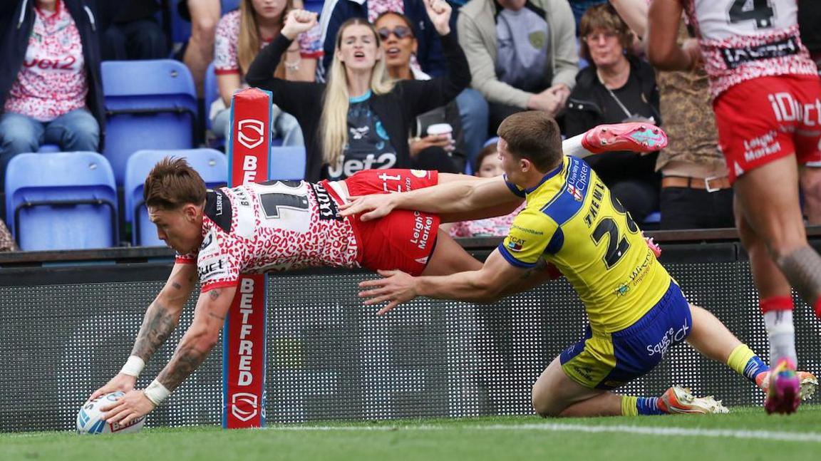 Leigh Leopards' Keanan Brand scores a try against Warrington