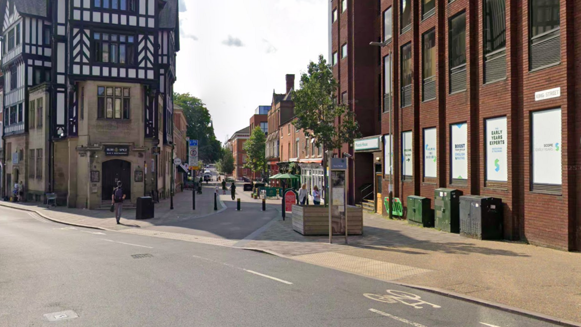 A Google Street View photograph of a road with offices on either side of the pavement where the incident is alleged to have happened.
