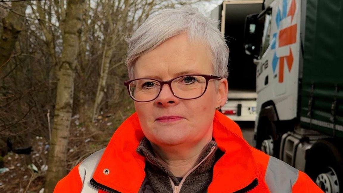 North Leicestershire volunteer litter picker Carly Hosker wearing a high-vis jacket