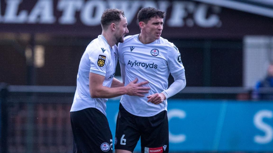 Bala Town's Eddie Clarke (L) celebrates with Aeron Edwards