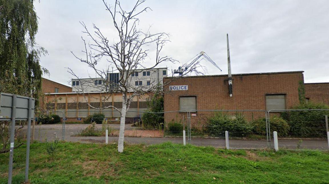 The derelict buildings on the previous site of the Exeter Police Station on Heavitree Road