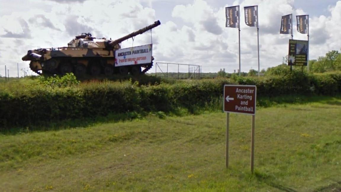 Sign pointing to Ancaster paintball centre