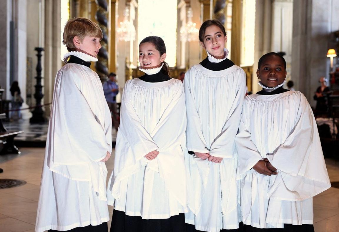 choir members standing and smiling. 