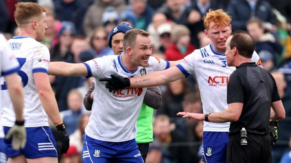 Monaghan players protest to Meath referee David Coldrick after the final whistle