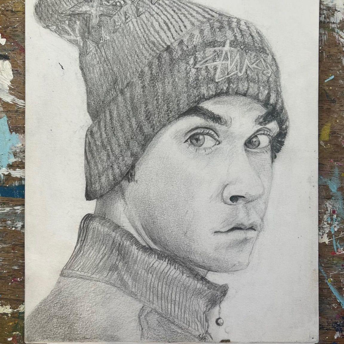 A pencil portrait of Robbie Williams