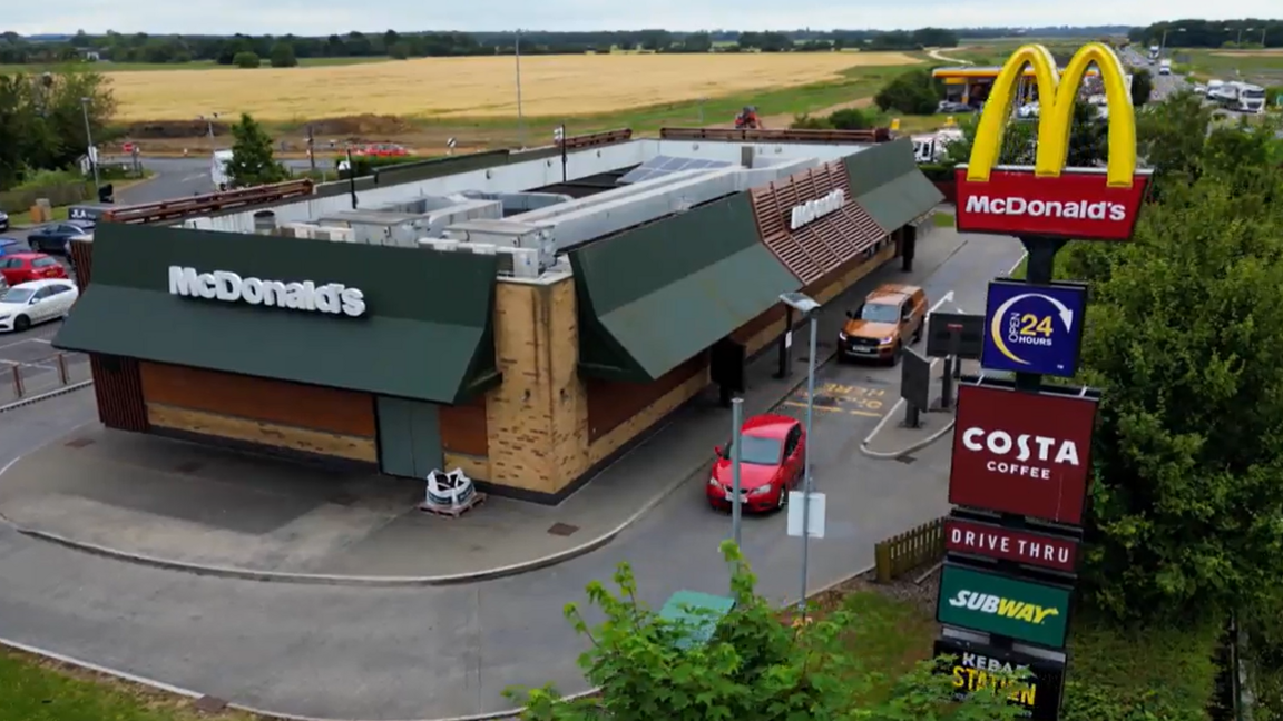 Aerial view of the drive-through McDonald's at the Caxton Gibbet roundabout, with the yellow M logo on top of a pole