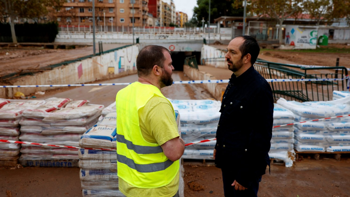 Guillermo Lujan, the mayor of Aldaia, stands in front of sandbags which have been placed to channel the water and prevent it from entering the town centre in anticipation of a new DANA in Aldaia, Valencia, Spain