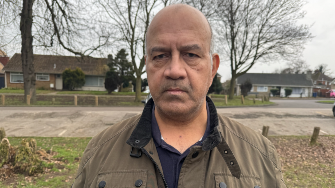 Raghu Malhotra standing in a park