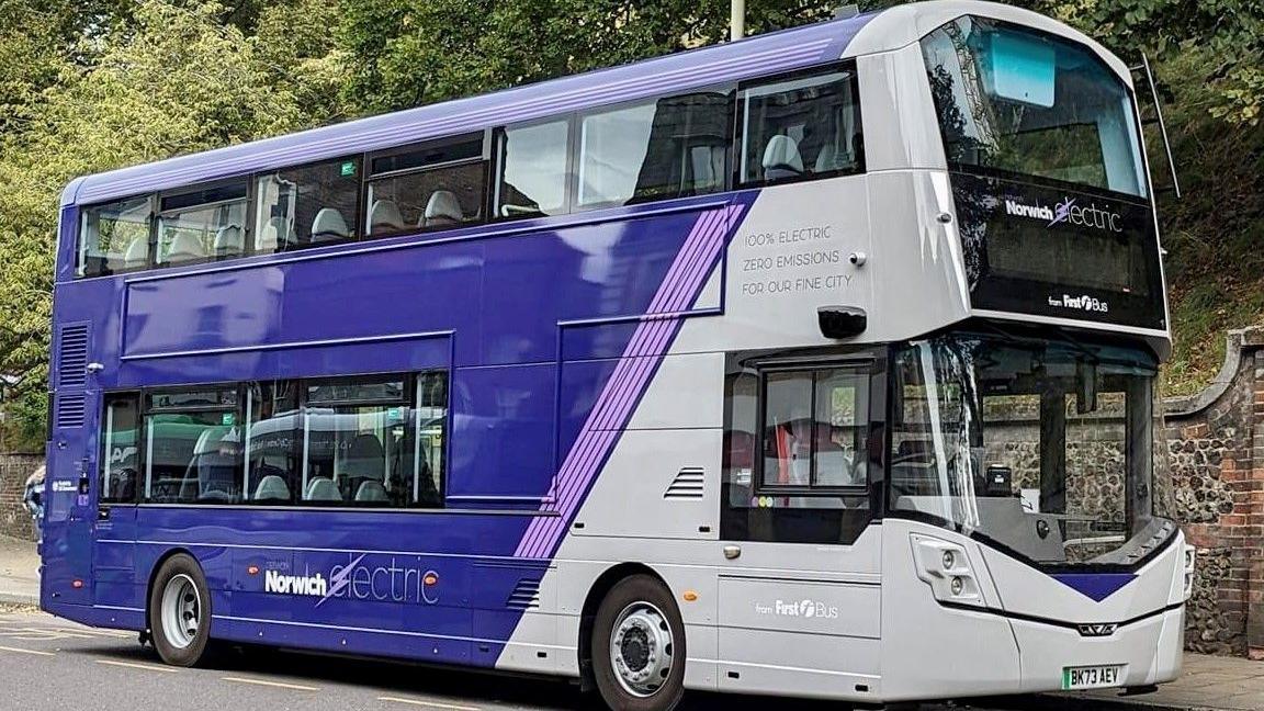 A blue and white electric bus