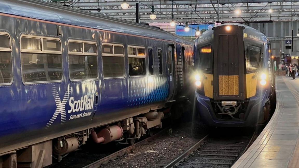 blue trains with ScotRail written on the side