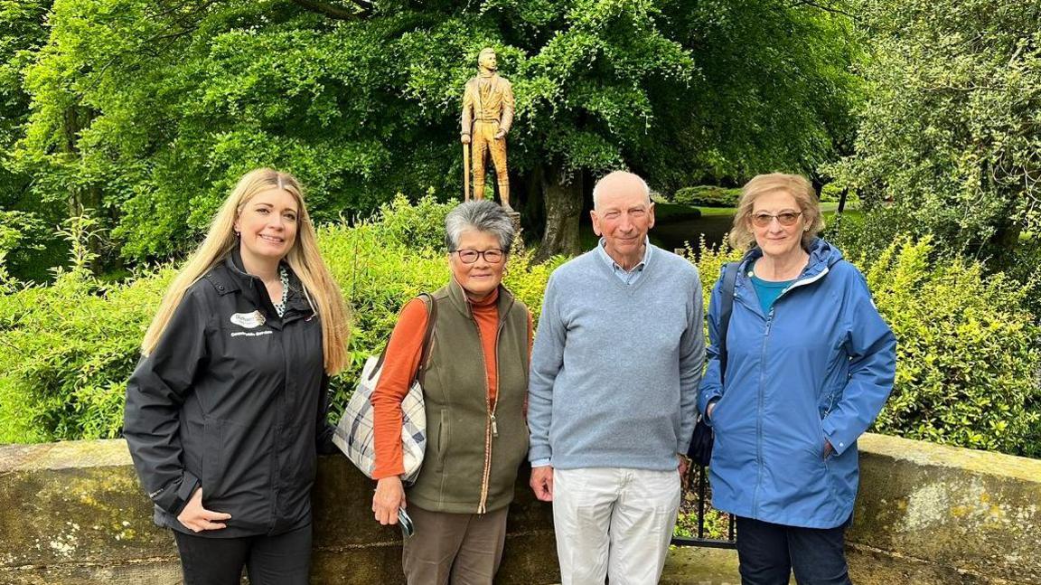 Wharton Park programme officer Louise Vest, Teresa Wharton, Richard Wharton and Jill Hollingworth, Chair of the Friends of Wharton Park, in front of the statue of Richard’s ancestor, William Lloyd Wharton