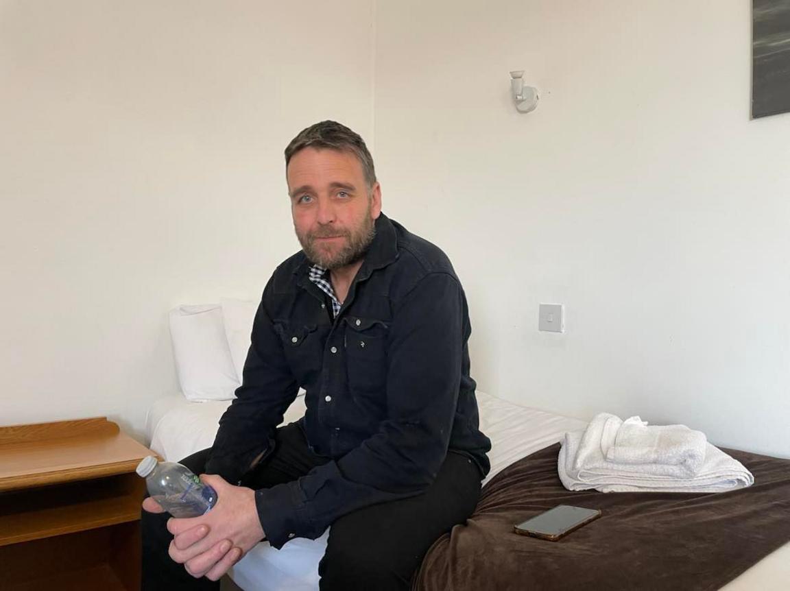 Terry Matthews pictured in a hotel room