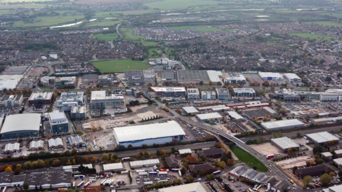 An aerial view of Slough trading estate shows rows upon row of industrial buildings.