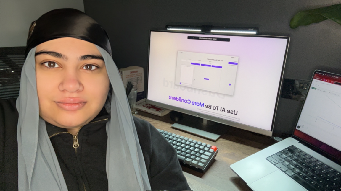 Luton businesswoman Angelina Aziz sitting in an office with her computers