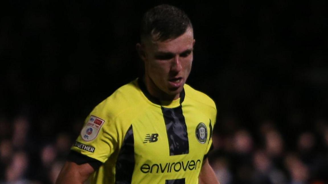 Jack Muldoon playing for League Two side Harrogate Town