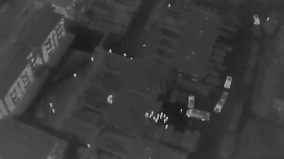A police raid in St Vincent Road on 31-1-25. The aerial black-and-white photo apparently shows a group of police officers at the front of a property, with others stationed around the sides and back.