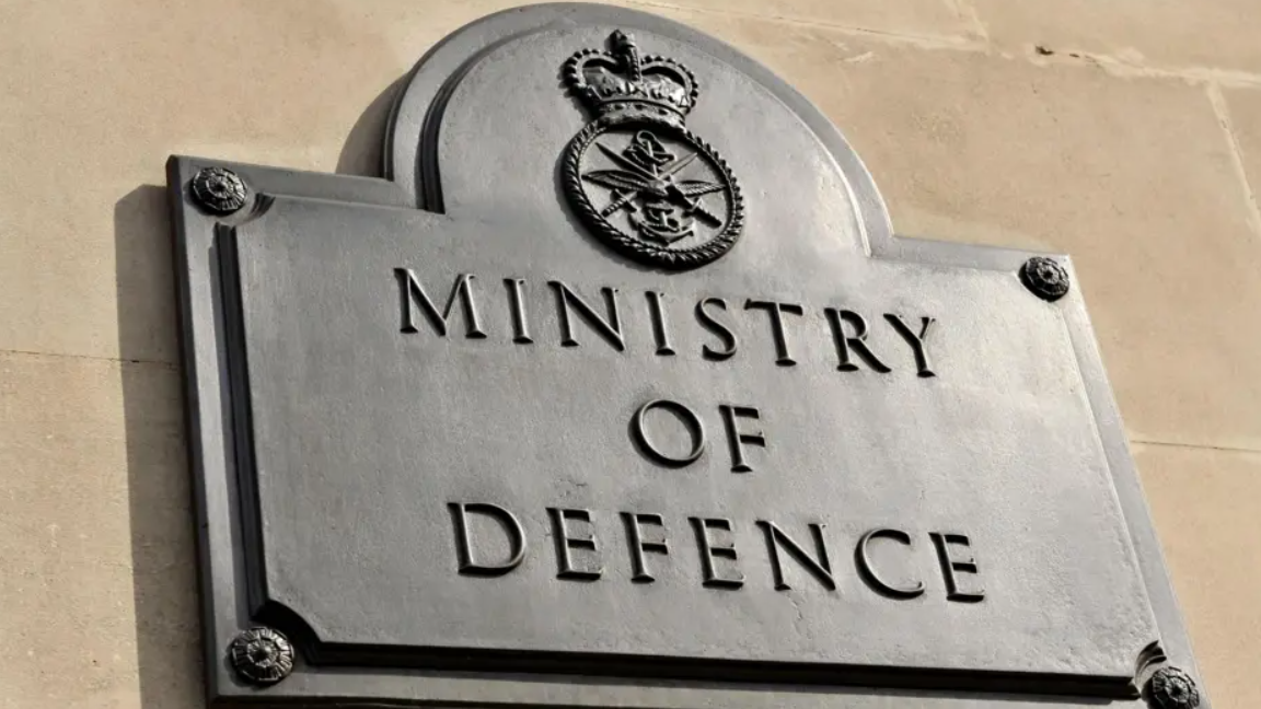 A sign which reads 'Ministry of Defence'.