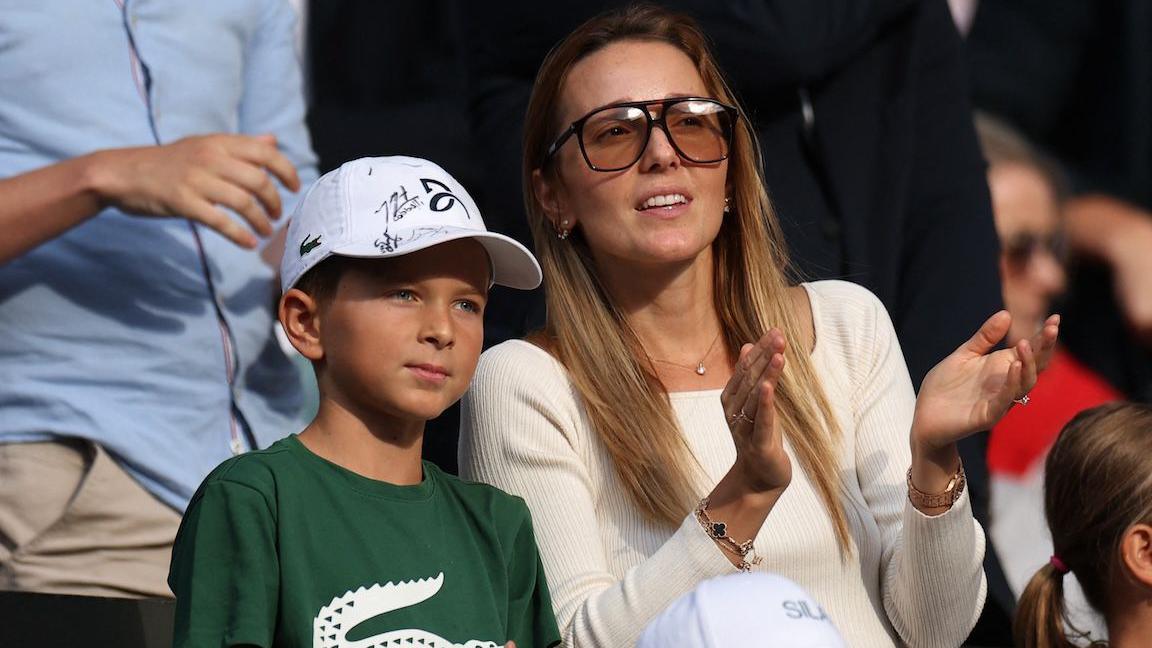 Stefan Djokovic standing next to his mum Jelena.