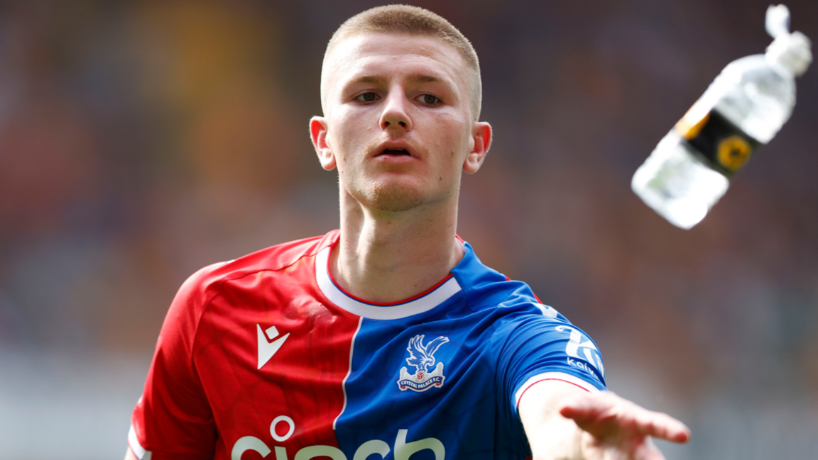 Crystal Palace midfielder Adam Wharton catches a water bottle during the Premier League match with Wolves