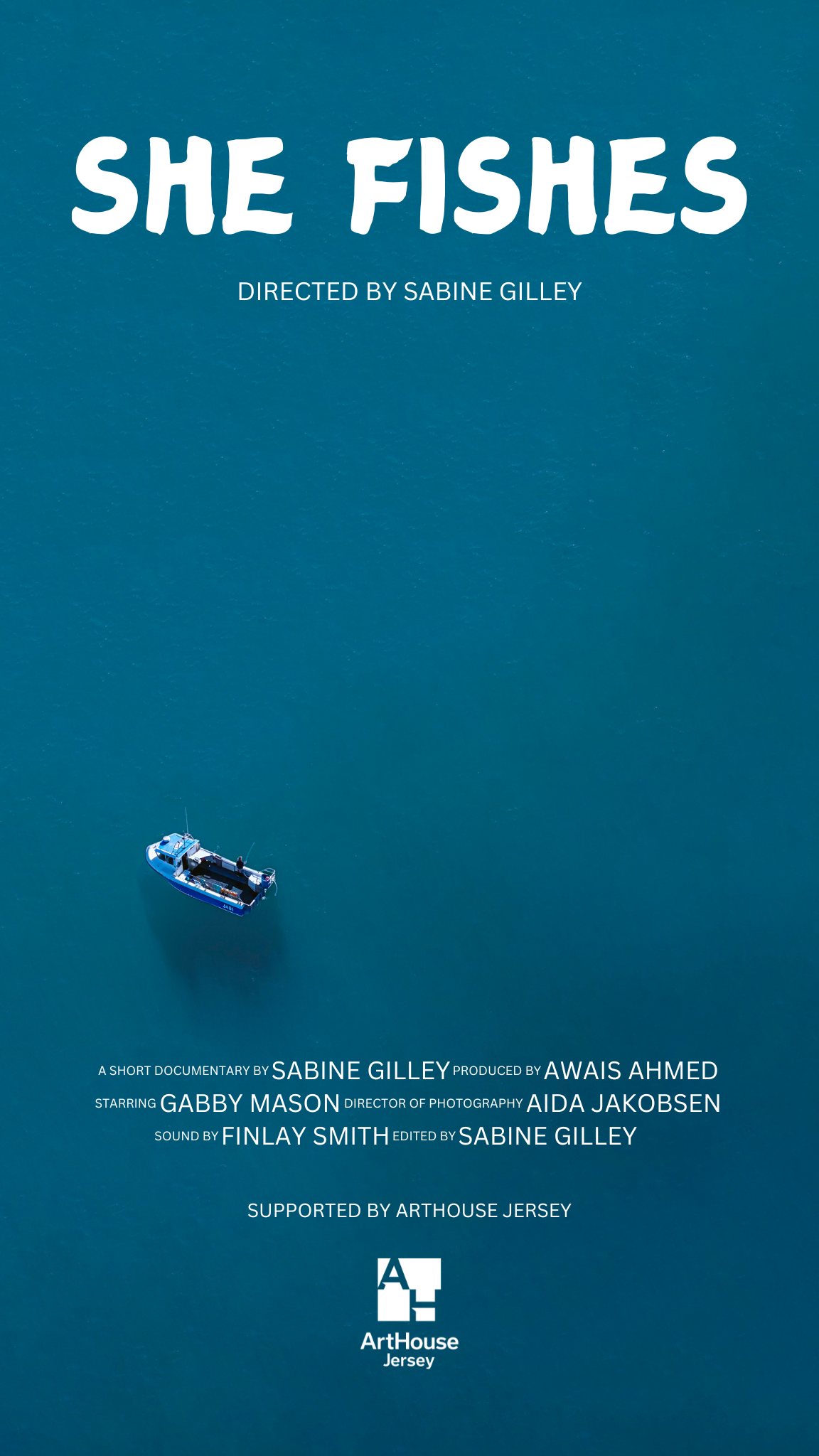 A movie poster for She Fishes. It shows a birds eye view of a fishing boat on the open water 