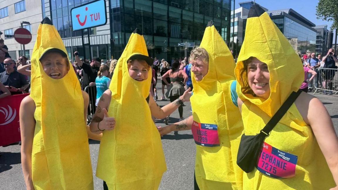 A group of runners dressed in banana costumes