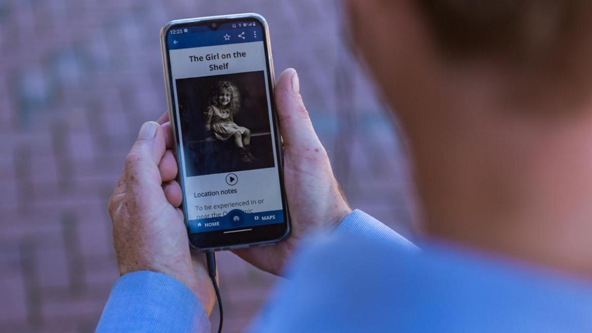 An audio story being listened to on a smartphone