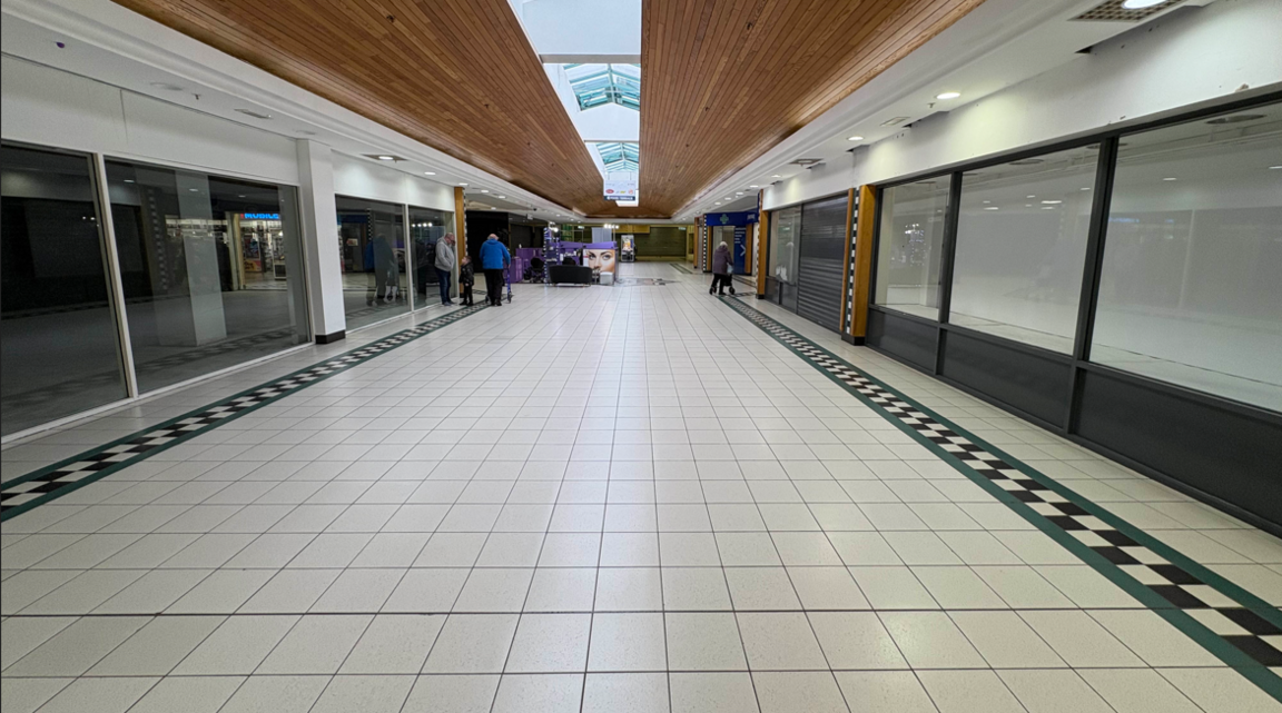 Inside of Connswater Shopping Centre, showing floor tiles and windows