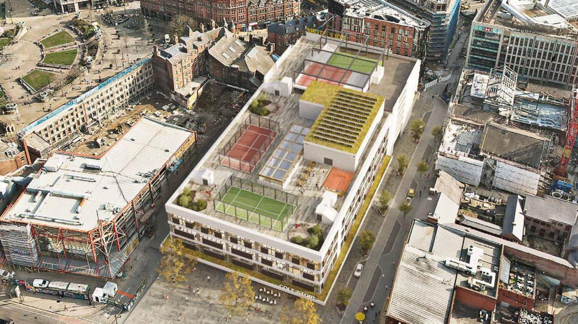 A building with a football pitch on the roof, along with solar panels, a padel court, tennis courts and a seating area