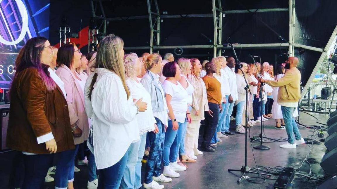 The choir performing on stage